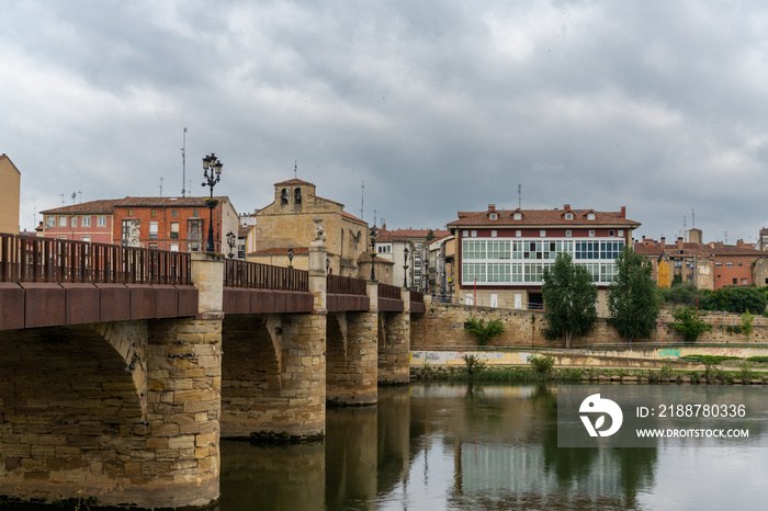 view of the stone bridge across the Ebro River and the historic city center of Miranda de Ebro