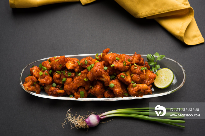 Gobi Manchurian dry - Popular street food of India made of cauliflower florets, selective focus