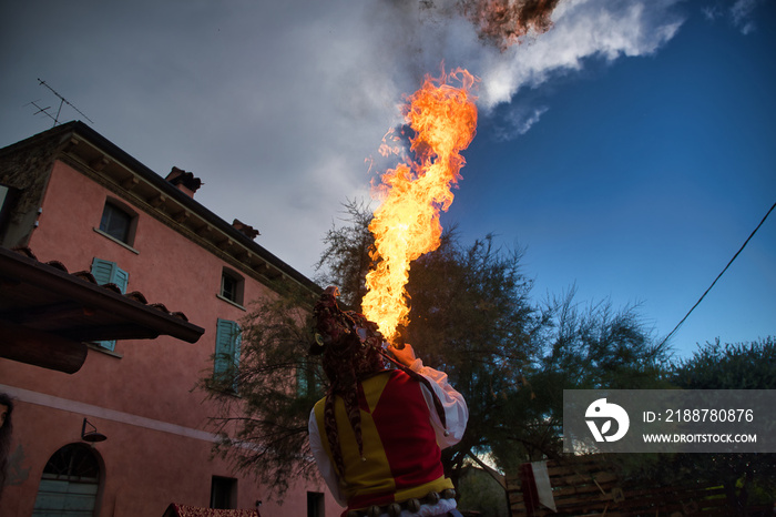 A Jester performing fire breathing in Monzambano at Mercatus Medievalis