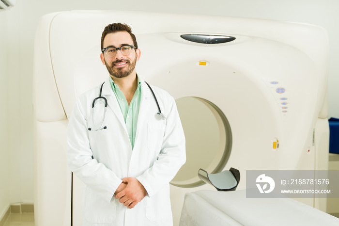 Attractive doctor waiting to do a computed tomography at the lab