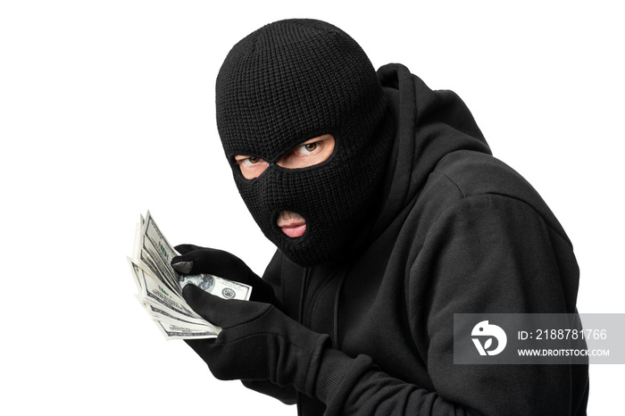 Masked thief counting money isolated over white wall