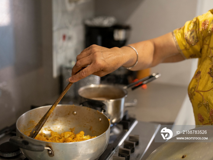 Woman cooking traditional meal at home