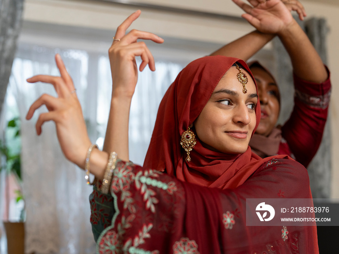 Women dancing during Ramadan celebration at home