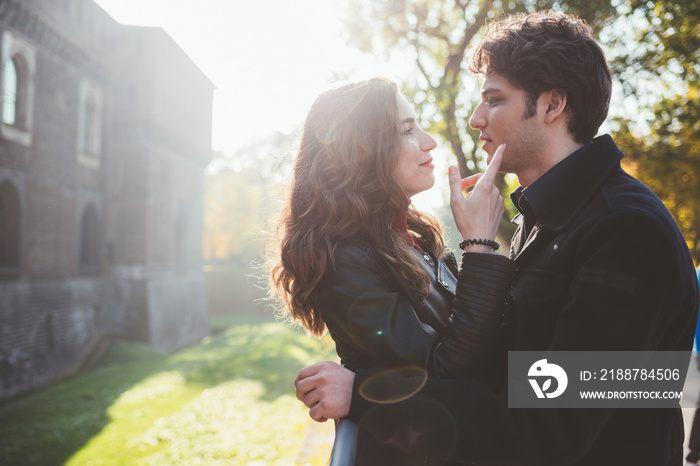 Couple looking at each other while standing outdoors