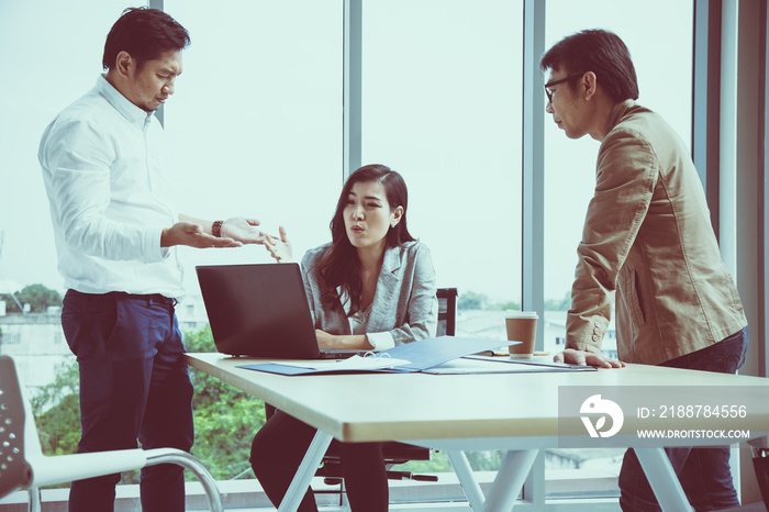 Asian female secretary argue Managing Director and Manager in meeting room; Business stress concept