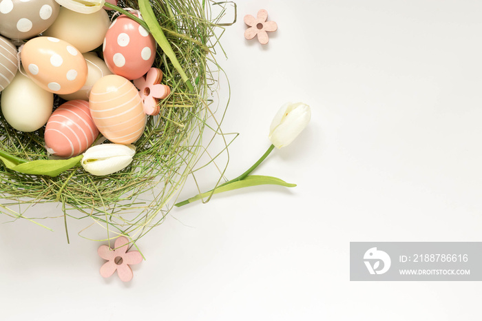 Easter egg decoration with pastel colors, top view. Empty space on the right.