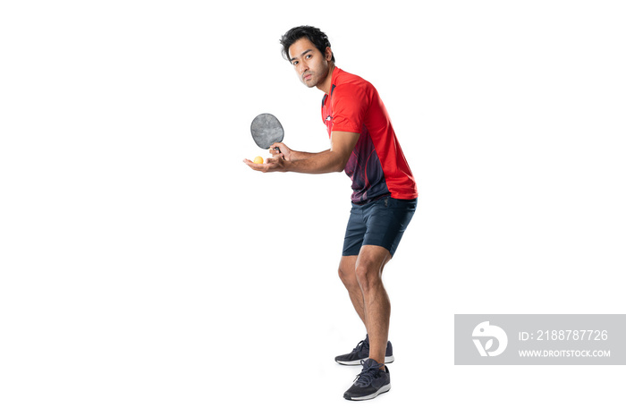 Portrait of sports man male athlete playing table tennis isolated.