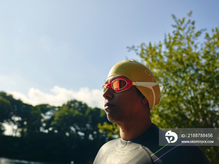 Woman in swimming cap and goggles