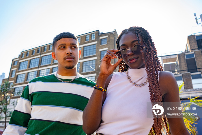 Fashionable young friends in city