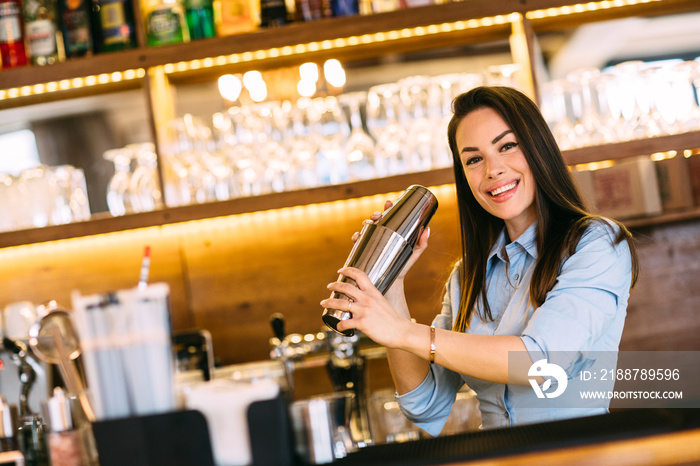 Girl shaking a cocktail