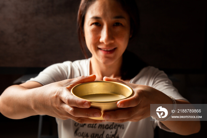 Asian women enjoying drinking makgeolli to celebrate. Makgeolli rice wine is a Korean fermented alcoholic beverage traditional drinks.