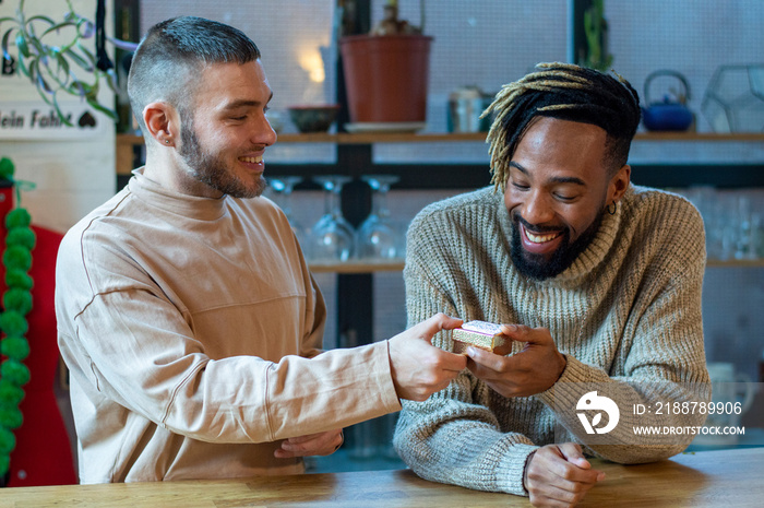 Man giving gift to friend