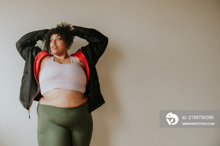 portrait of a plus size afro indigenous person wearing workout gear