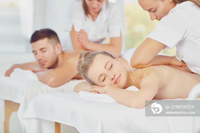 Couple enjoying massage body at the spa center