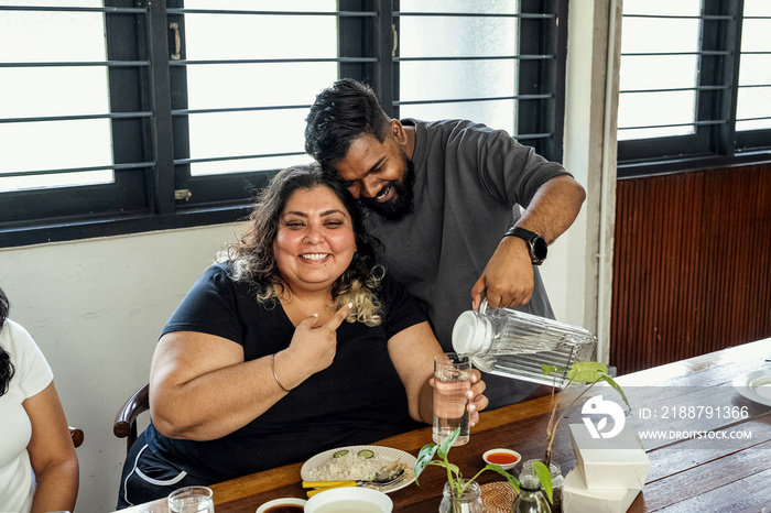 Friends having lunch together at home