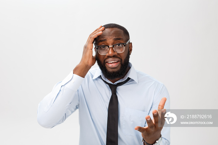 Portrait of desperate annoyed black male screaming in rage and anger tearing his hair out while feeling furious and mad with something. Negative human face expressions, emotions and feelings.