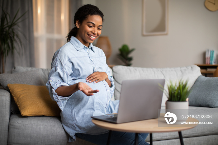 Pregnant African Lady Making Video Call Talking To Laptop Indoor