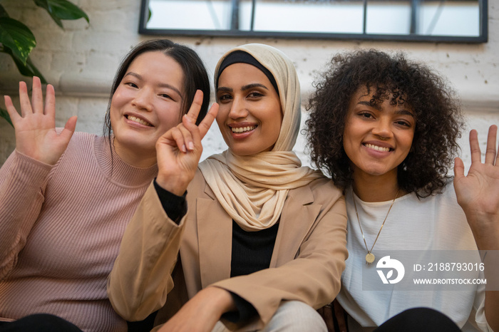 Portrait of smiling women gesturing