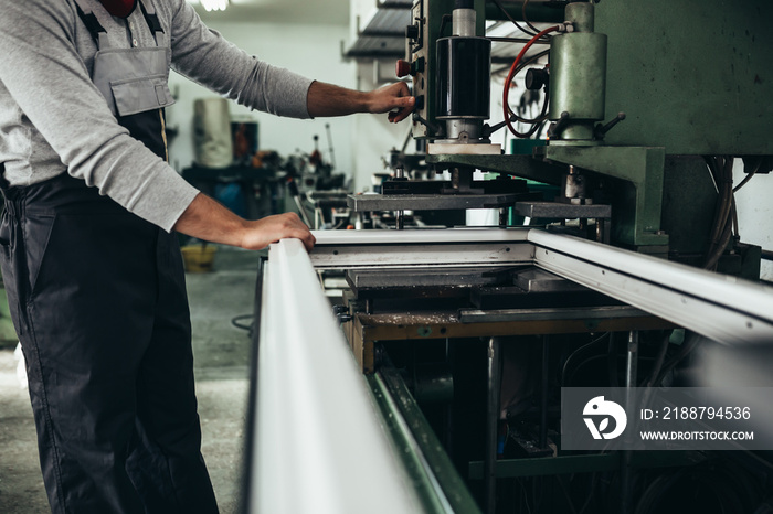 closeup of worker making pvc windows