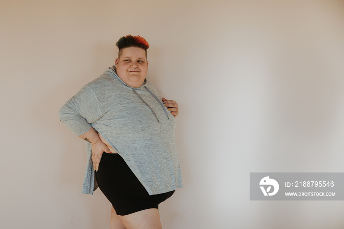 portrait of a plus size woman wearing shorts