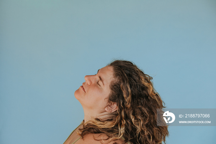 profile portrait of a plus size woman eyes closed