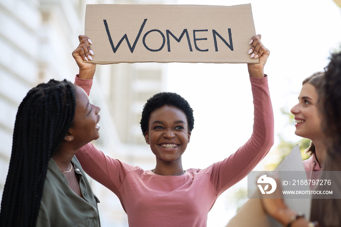 Cheerful black woman holding placard, fighting for women rights