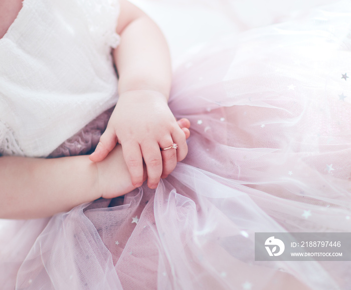 beautiful golden finger ring on the little hands of adorable toddler princess girl