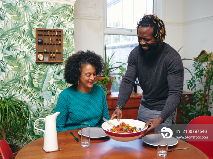 Couple preparing to eat lunch at home