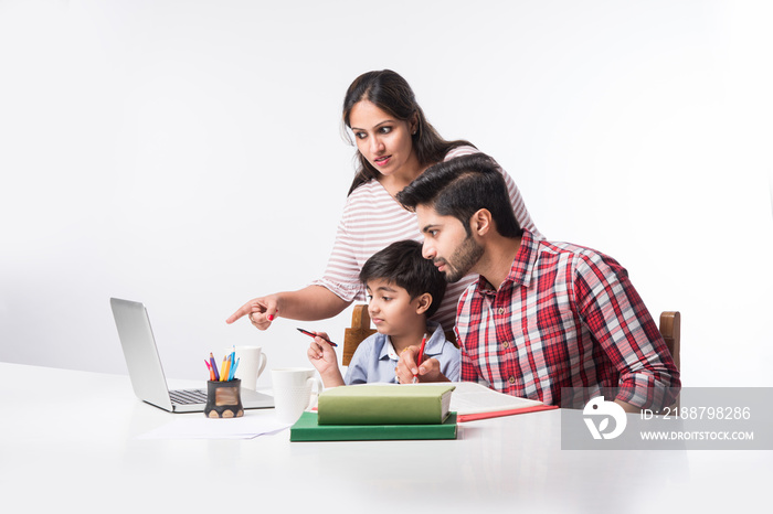 Online school in India concept - Cute little son taking parent’s help in studies or homework