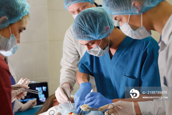 a group of surgeons doing operations in a hospital.