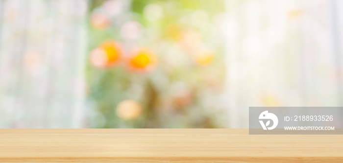 Empty wood table top with blur white curtain window and green garden background for product display 