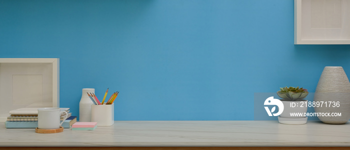 Workspace with stationery, decorations and copy space in home office room