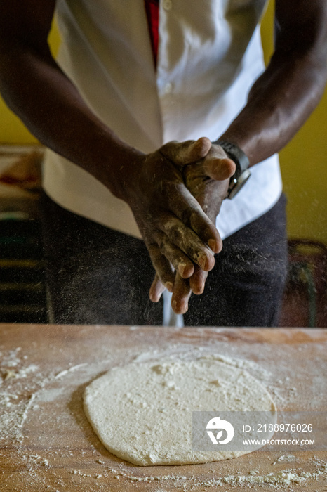 chef dusting flour from his hands