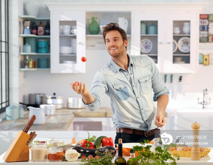 Young man having fun in kitchen