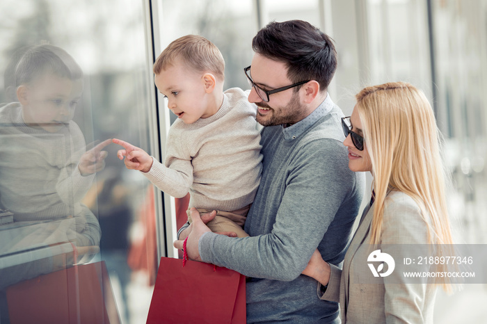 Happy family with shopping bags