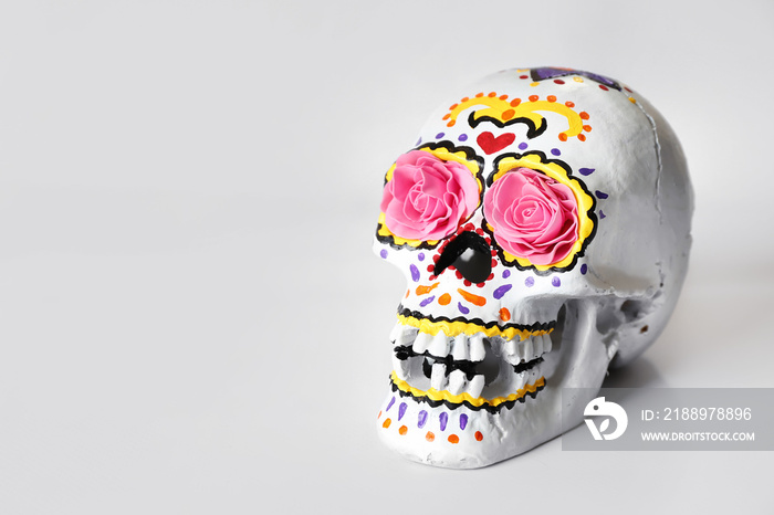 Painted human skull for Mexicos Day of the Dead on white background