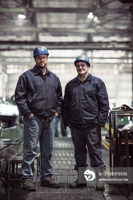 Portrait of two factory workers