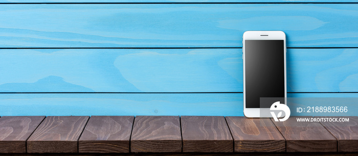 Modern smartphone on wooden background
