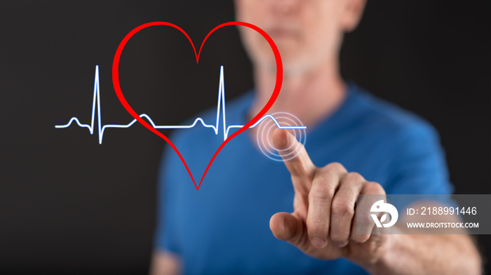 Man touching a heart beats graph on a touch screen