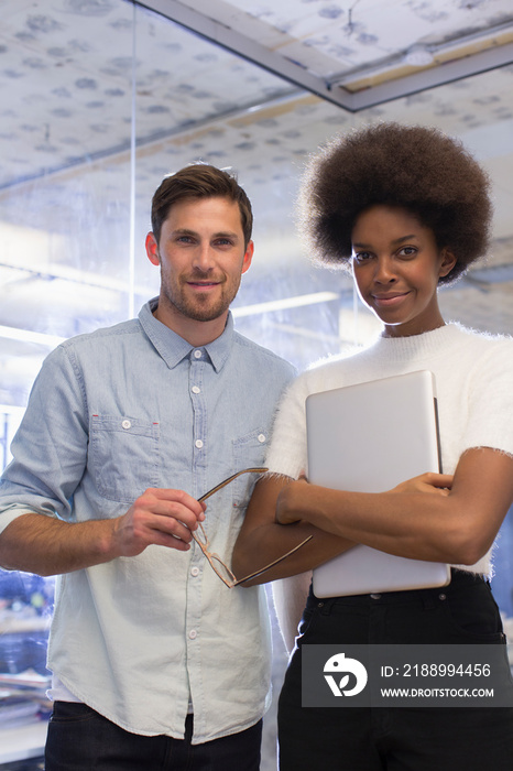 Portrait confident young business people in office