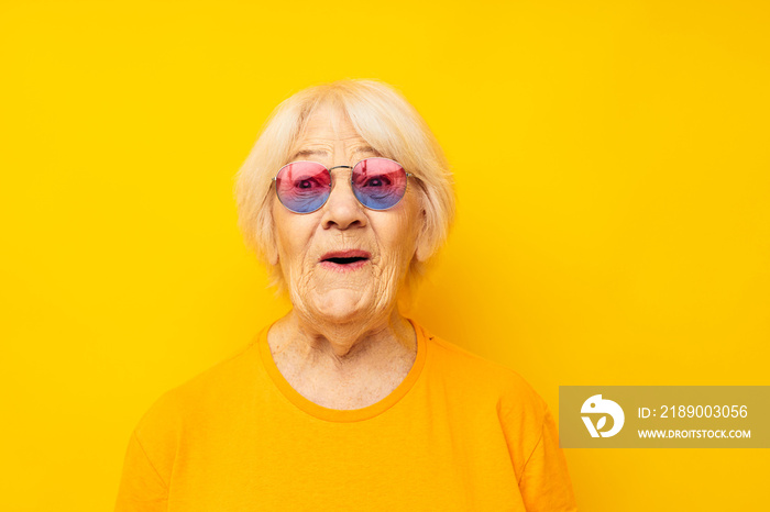 elderly woman in fashionable glasses isolated background