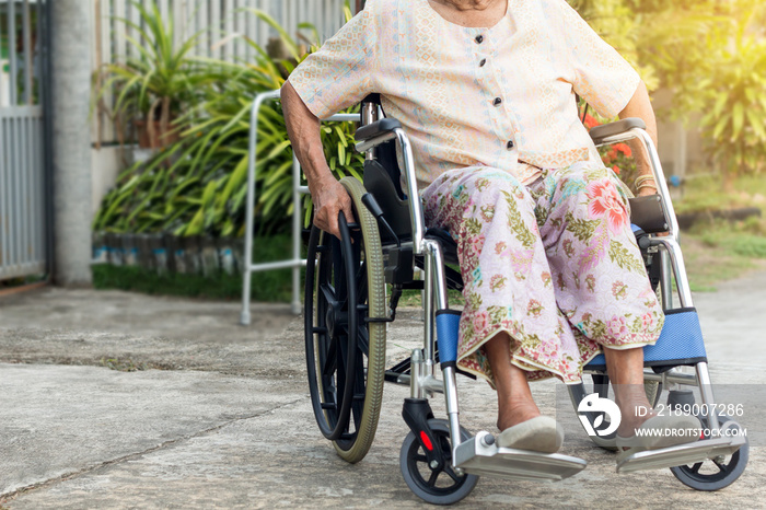 Asian senior or elderly old lady woman patient on wheelchair at the front house,healthy strong medic