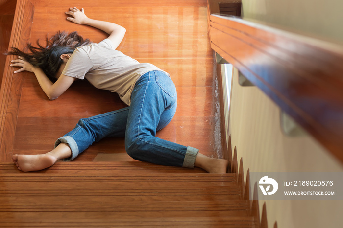 unconscious woman falling down from staircase