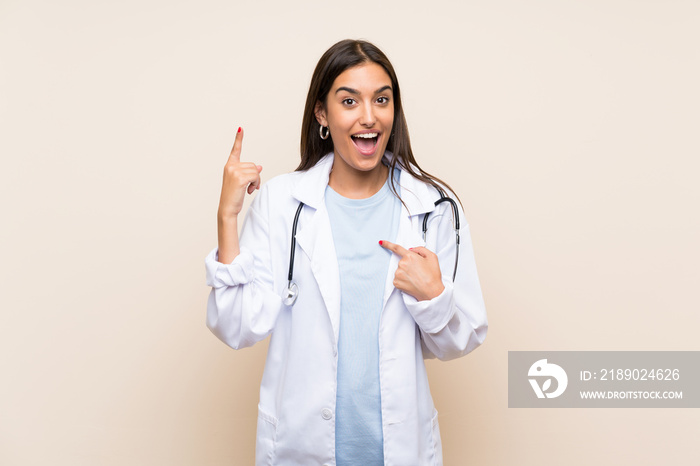 Young doctor woman over isolated background with surprise facial expression