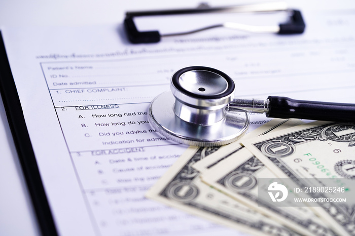 Health insurance accident claim form with stethoscope and US dollar banknotes, Medical concept.