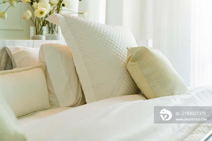 close up white beige soft pillows on bed and blanket bedroom interior design concept.bed maid luxury