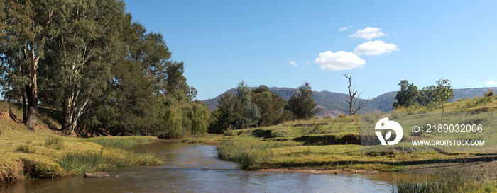 panoramic views of green native Australian farm land around a washed out river crossing near propert