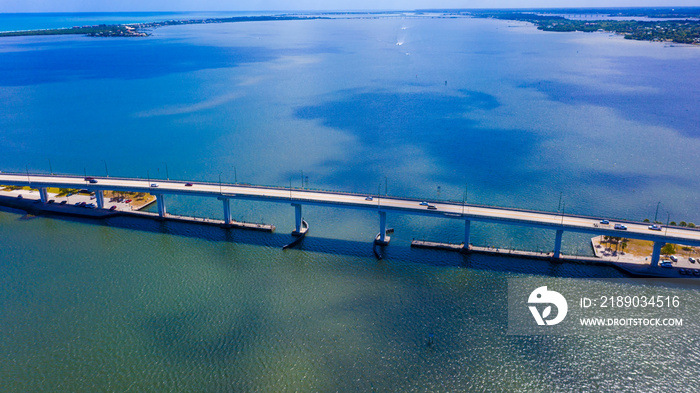 Jensen Beach Causeway Bridge on Aqua green water Stuart Florida in Background