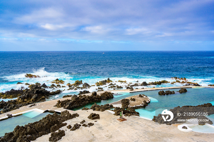 Natural volcanic swimming lagoon pools at Porto Moniz, travel destination for vacation, Madeira isla