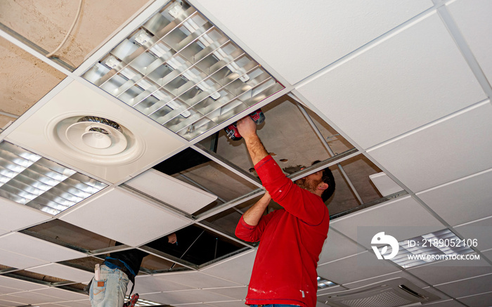 Suspended ceiling with drywall and fixing the drywall to the ceiling metal frame.